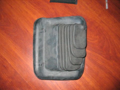 1991 Ford Bronco - A rubber shift boot with a bellows design is shown against a wooden background.