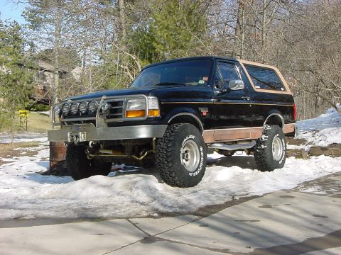 1994 Ford Bronco - This modified Ford Bronco sits in a snowy driveway, ready for winter conditions.