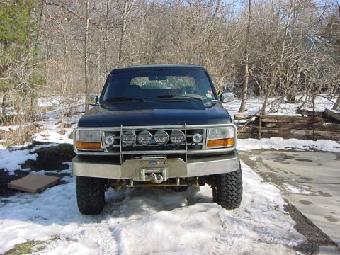 1994 Ford Bronco - This Ford Bronco, likely from the early to mid-1990s, is equipped with a heavy-duty bumper and auxiliary lights.