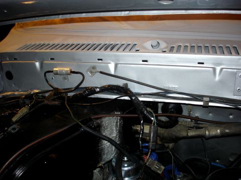1979 Ford Bronco - Close-up view of the engine bay, showing various wires and mechanical parts.