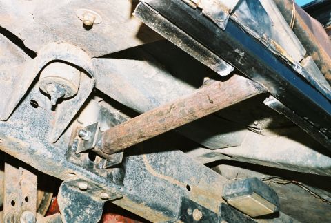 1978 Ford Bronco - Close-up view of the undercarriage, highlighting suspension parts and a custom metal bar installation.