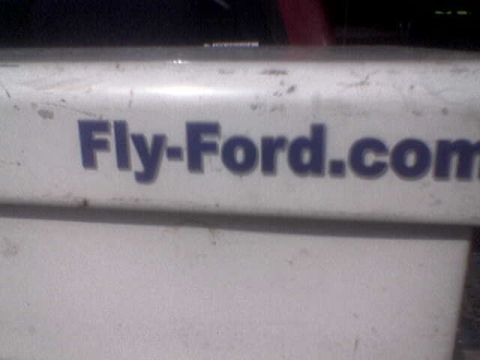 1988 Ford Bronco - The text "Fly-Ford.com" is visible on a white surface, possibly a vehicle part.