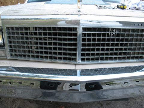 1985 Ford LTD Crown Victoria - The front grille and bumper of a 1985 Ford Crown Victoria LTD are visible in this close-up photo.