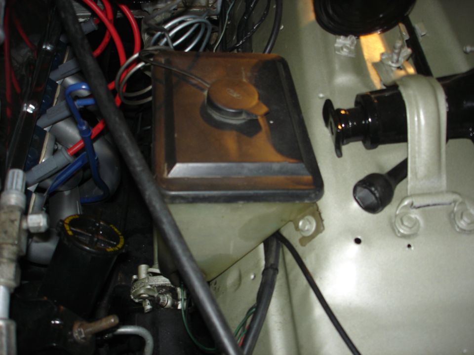Engine bay windshield washer fluid reservoir and wiring