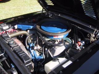 1968 Shelby GT500 - Close-up view of a car's engine compartment, showing various components and wiring.