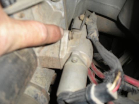 1990 Ford Bronco - Wiring connected to a vehicle's starter motor.
