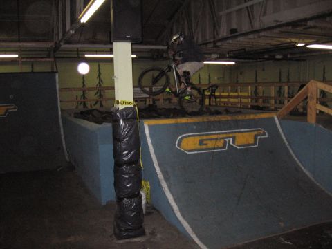 1997 Ford Probe - An indoor skatepark features ramps and obstacles for bicycle stunts.