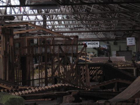 1997 Ford Probe - Interior scene of a warehouse with extensive wooden construction, possibly for an event or exhibit.