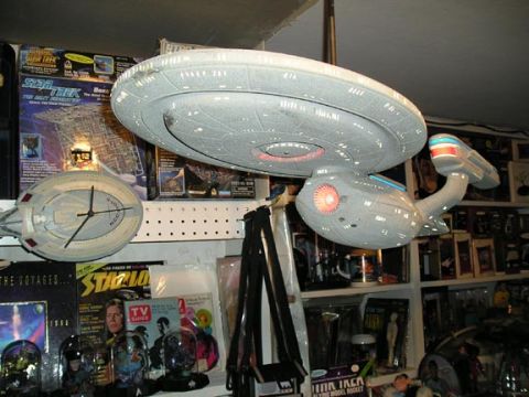 1966 Pontiac Fiero - A collection of Star Trek models and memorabilia is displayed on shelves.