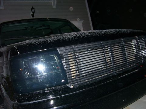 1996 Ford Bronco - Front view of a black Ford Bronco, likely from the early to mid-1990s, with custom lighting.