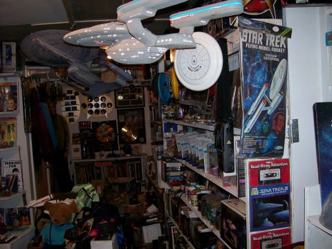 1966 Pontiac Fiero - A collection of Star Trek models and memorabilia fills shelves and hangs from the ceiling, various starships and related items.