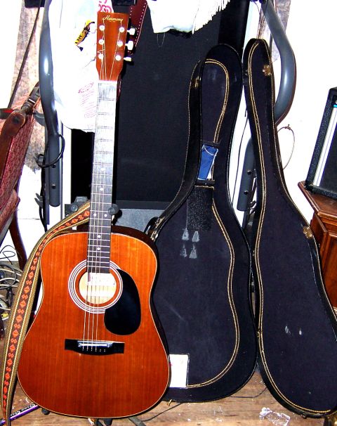 1978 Ford Bronco - A collection of acoustic guitars and their protective cases are displayed.