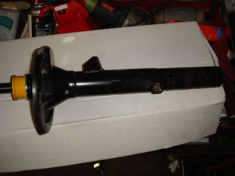 1993 Ford Taurus - Distributor cap and rotor assembly, likely for an older vehicle.