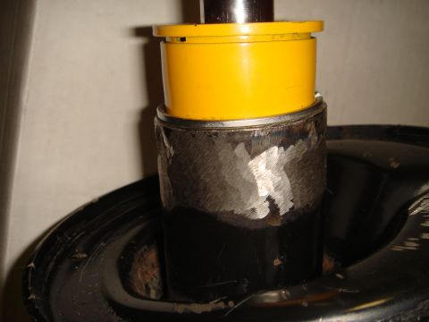 1993 Ford Taurus - A yellow cap is visible on a metal part, with no clear indication of the vehicle it belongs to.