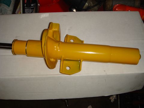 1993 Ford Taurus - A close-up view of a yellow dipstick handle, likely for checking fluid levels.