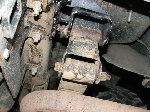 1996 Ford Bronco - This image shows the underside of a vehicle, focusing on the suspension system and exhaust pipe.