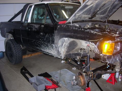 1985 Toyota Hilux - This 1985 Toyota Hilux is being worked on, with the front end disassembled for repairs.