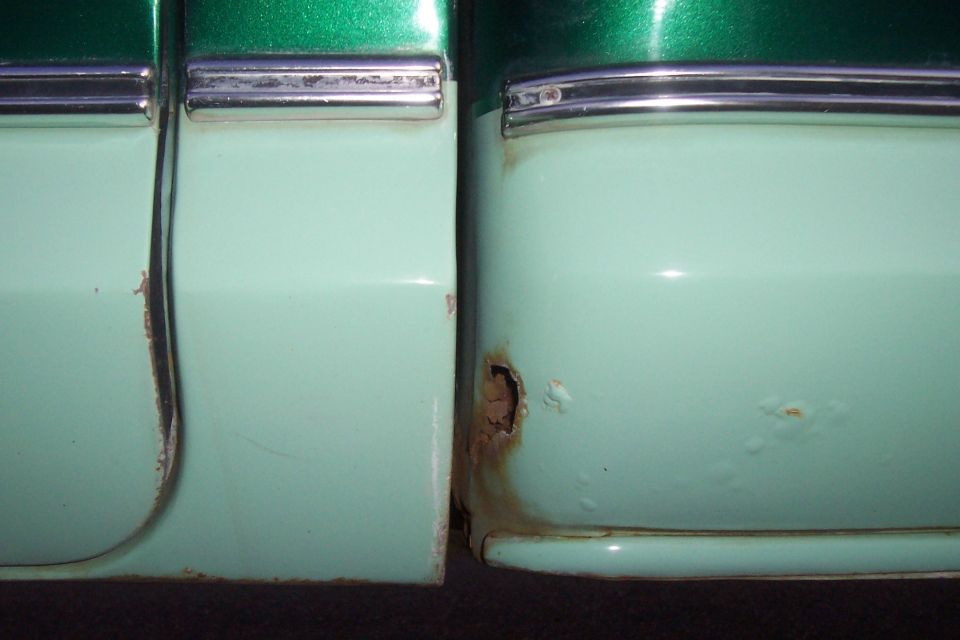rust bubbles in paint and rust through hole on right rear lower cab corner