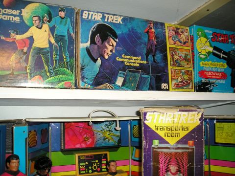 1966 Pontiac Fiero - Collection of vintage Star Trek toys and game boxes displayed on shelves.
