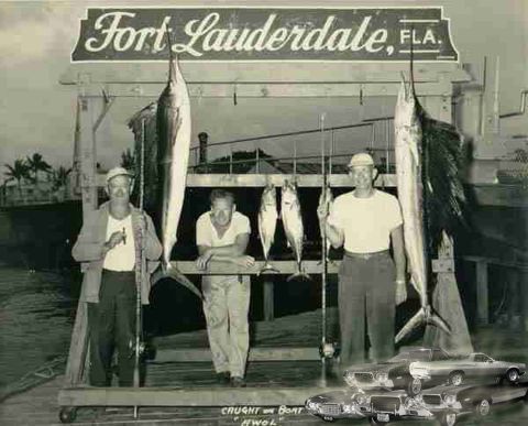 1971 Ford Ranchero - Three fishermen proudly display their catch under a sign indicating their location in Fort Lauderdale, Florida.