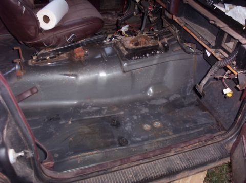 1987 Jeep Cherokee - Interior view of a 1987 Jeep Cherokee, focusing on the floor and seat mounts.