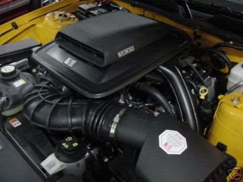 2007 Saleen S-302 - Close-up of a car's engine bay, showing the air intake and engine cover with a "302" emblem.