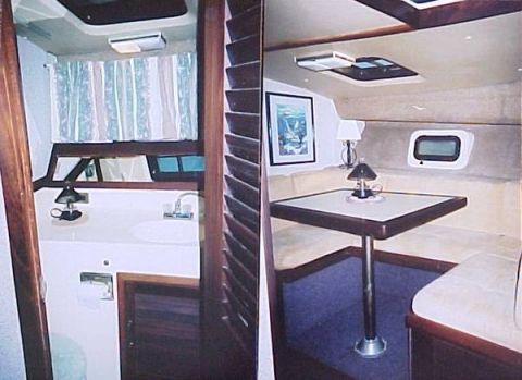 1982 Ford Bronco - Interior view of a boat showing the galley and dinette areas.