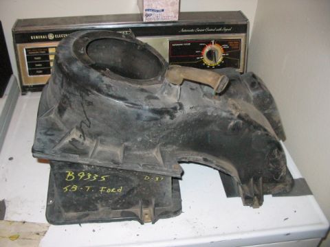 1991 Ford Bronco - This is a Ford HVAC ducting part, possibly for a truck, with handwritten identification marks.