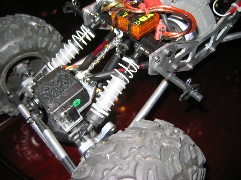 1985 Ford Bronco - Close-up view of the suspension and electronic components of a remote control truck.
