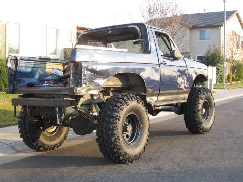 1994 Ford Bronco - This modified Ford Bronco features large off-road tires and a custom rear bumper.