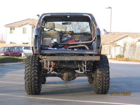 1994 Ford Bronco - This modified SUV has been lifted with large off-road tires and features a custom roll cage.
