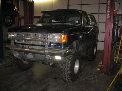 1990 Ford Bronco - This 1990 Ford Bronco is parked on a lift in a garage.