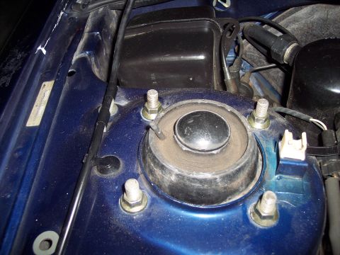 1995 Ford Probe - This image shows a close-up of a vehicle's strut mount assembly, not the entire car.
