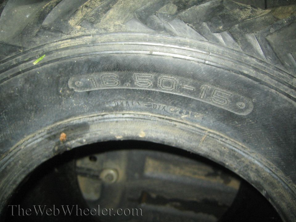 Close-up of a tire showing size 16.50-15