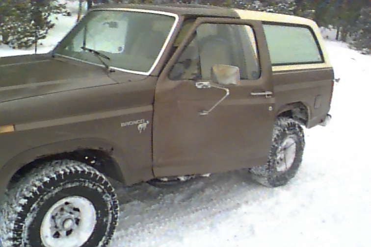 If you look close you can see how my door is dented pretty bad. The e-brake let loose allowing the truck to roll backward. Rob was able to jump in and get it stopped, but not before the door (it was open) hit a small stand of aspen trees, forceing it forward.