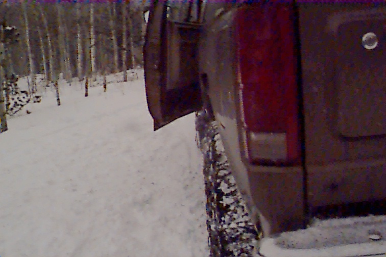 I tried to get a shot of the inside bottom center of the door here showing the way it's dented, creased, and buckled. Oh well, we had a blast up until then. Now the hunt for a door is on.