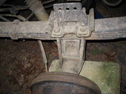 1990 Ford Bronco - Close-up view of a vehicle's rear axle and suspension components.
