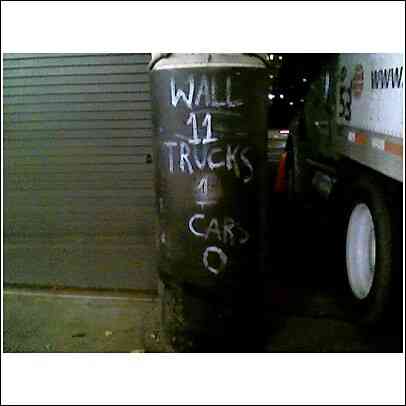 1994 Ford Bronco - A truck is partially visible next to a barrel with chalk writing.