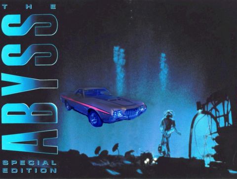 1971 Ford Ranchero - A blue 1971 Ford Ranchero with a pink stripe is shown in a stylized, dark scene with blue lighting effects.