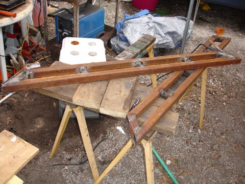 1989 Ford Bronco - Custom metal sliders are shown assembled on sawhorses, ready for installation.