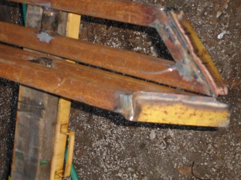 1989 Ford Bronco - These rusty metal sliders appear to be aftermarket additions, possibly for off-road use.
