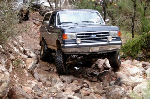 1991 Ford Bronco - This 1991 Ford Bronco is shown tackling a challenging rocky off-road path.