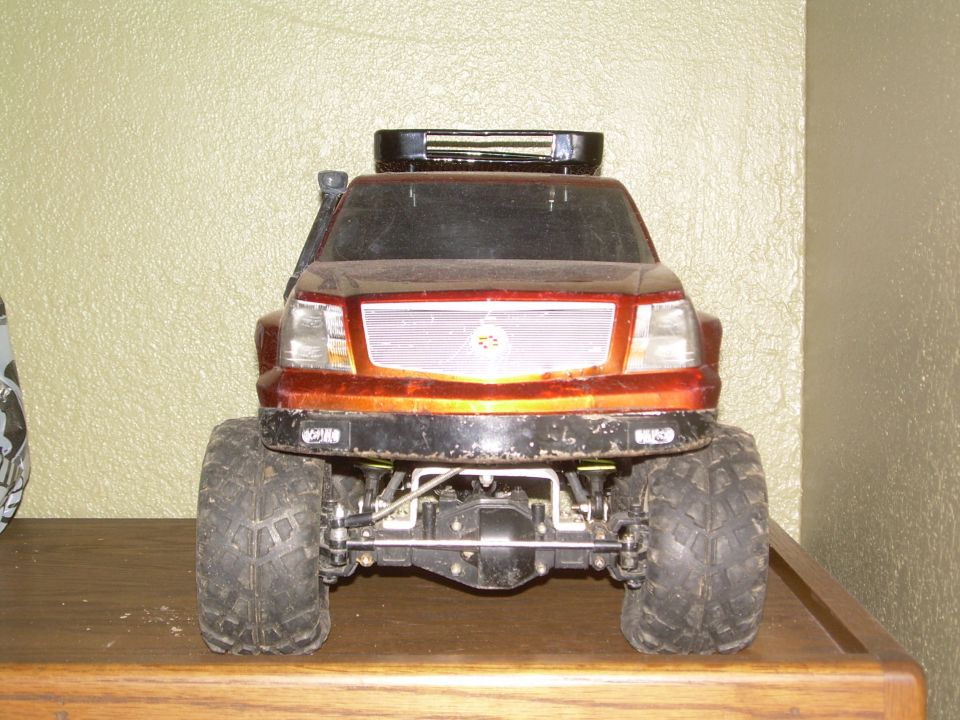 RC car with large tires and roof rack, front view