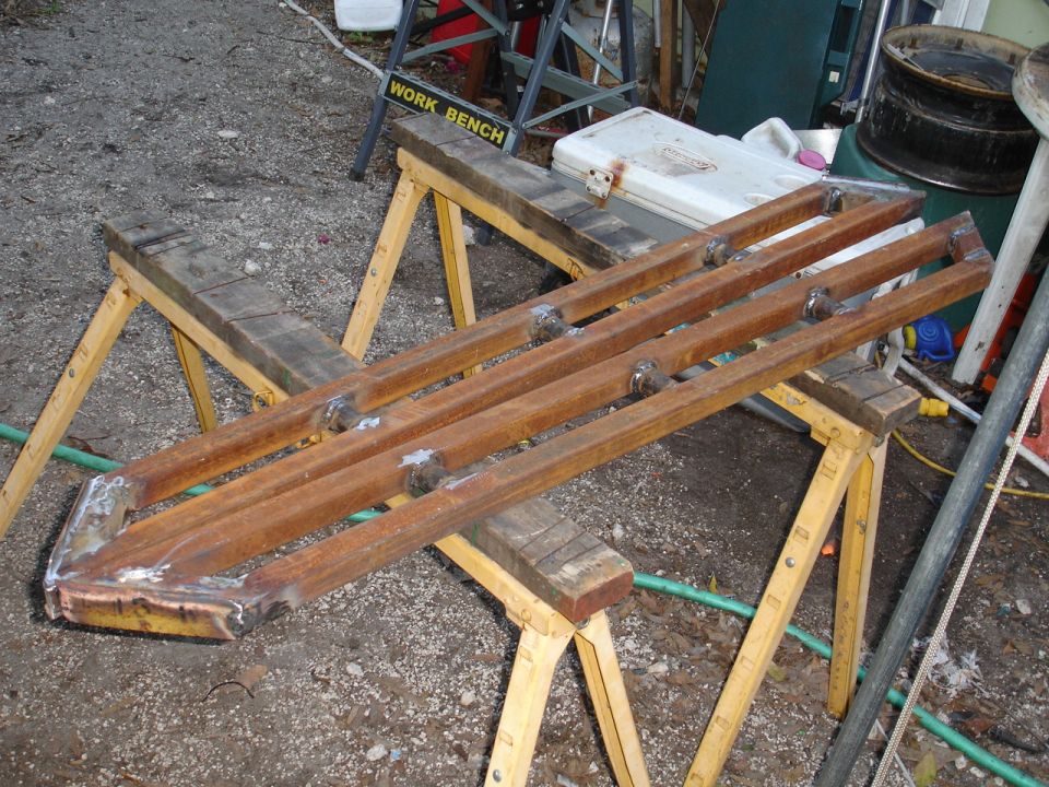 Rusty metal sliders on sawhorses