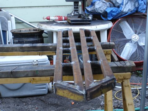 1989 Ford Bronco - Homemade metal ramps constructed from square tubing and angle iron, resting on sawhorses.
