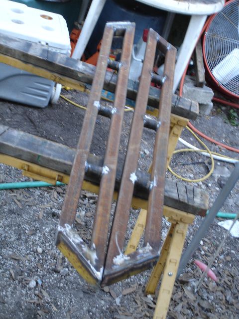 1989 Ford Bronco - These metal components appear to be custom fabricated parts, possibly for a vehicle or equipment.