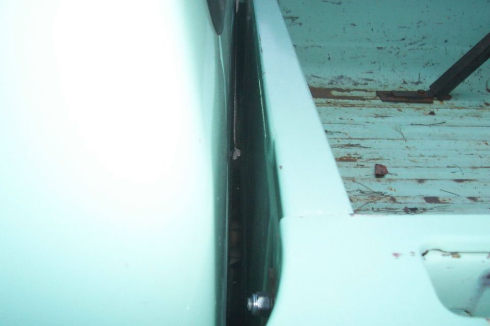 between bed and cab on left side