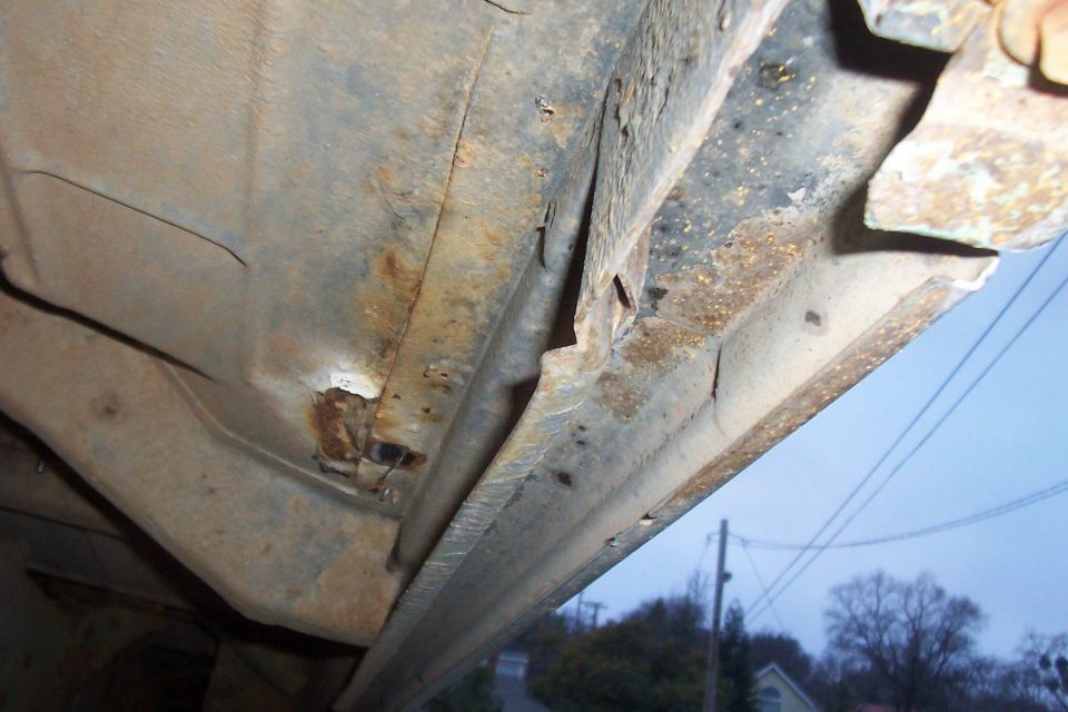 right side. Notice hole in floor under the sil plate. The rest of the floor is in great shape, this is the only place where there is a rust hole. A new panel can be easilly patched in if truck were ever to be painted