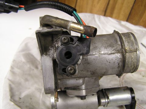 1990 Ford Bronco - New TPS. Notice how much i had to bore out to ge the TPS to 0.98 Volts at idle.