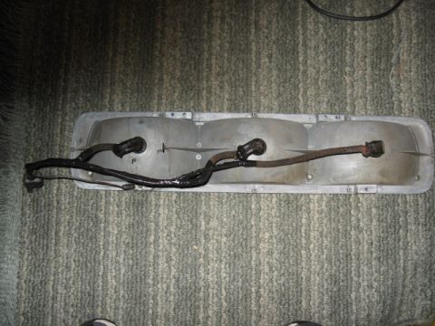 1968 Shelby GT500 - This is the rear housing of a car's tail light assembly, showing the wiring and bulb sockets.